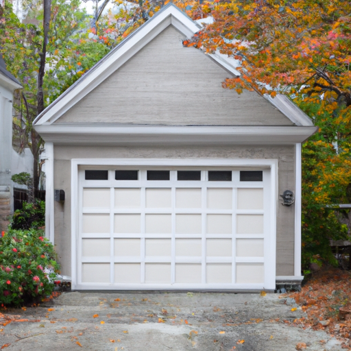 Colonial-style Dover, MA home with closed garage door, driveway, and autumn foliage in soft daylight.