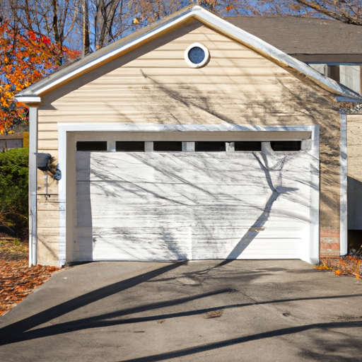 Suburban Dover home with a closed modern garage door on a tree-lined street in soft autumn light.